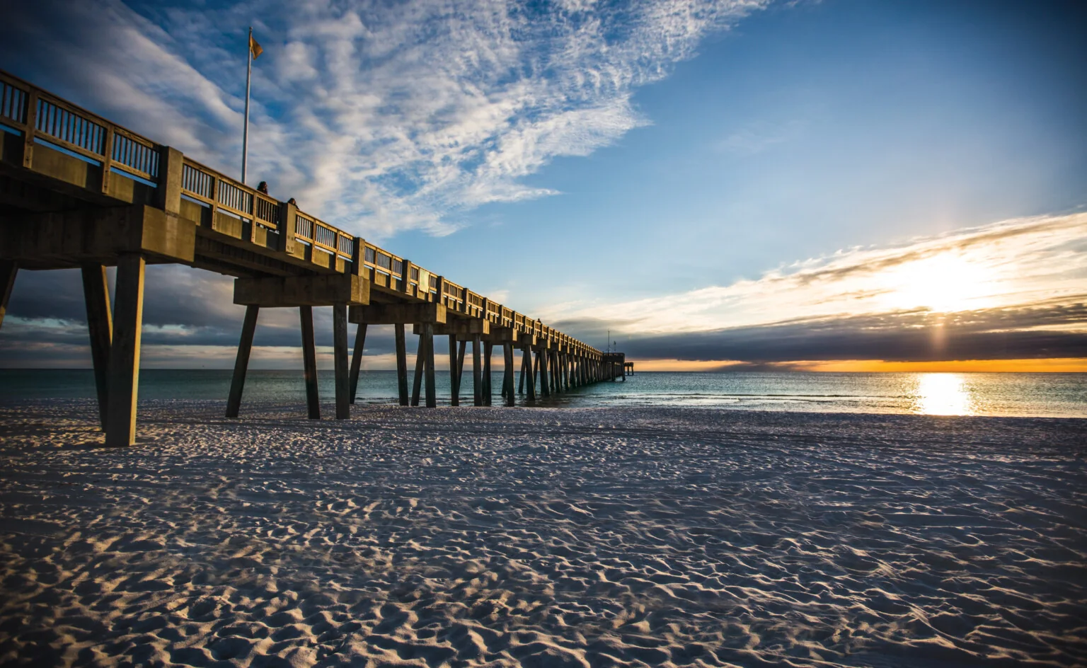 Pier and beach in Panama City Beach at sunset