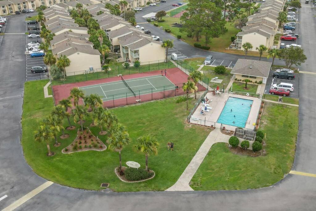 Aerial view of tennis court and pool at Gulf Highlands Resort